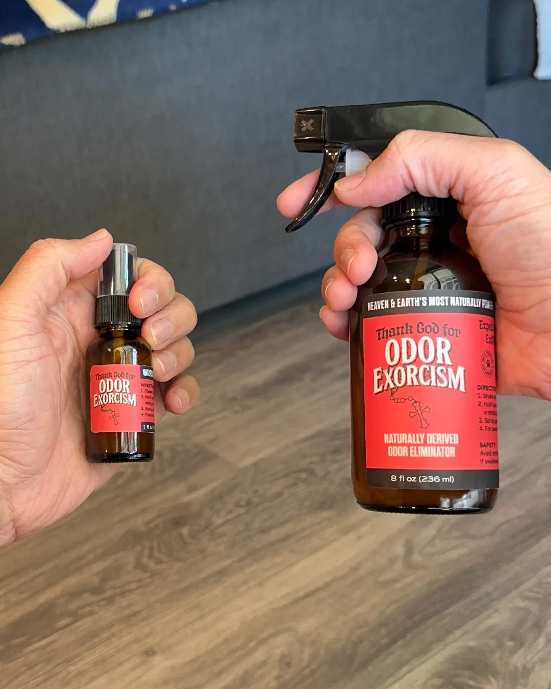 Two sizes of all-natural odor elimination spray from Odor Exorcism: 8 oz (in right hand) and 1 oz (in left hand).